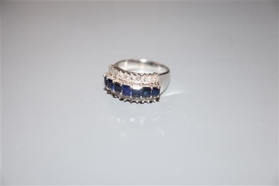 A modern 18k white metal and three row sapphire and diamond set dress ring, size O, gross weight 6.5 grams.